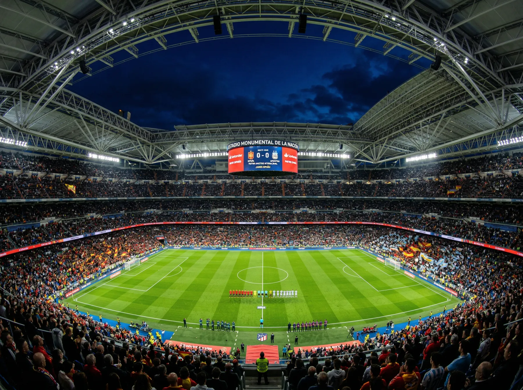 Vista panorámica de un gran estadio de fútbol con las tribunas llenas e iluminación nocturna durante un partido internacional